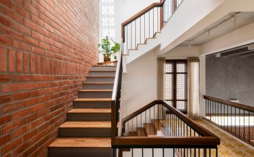 White walls and exposed brick highlight this Bangalore home's design